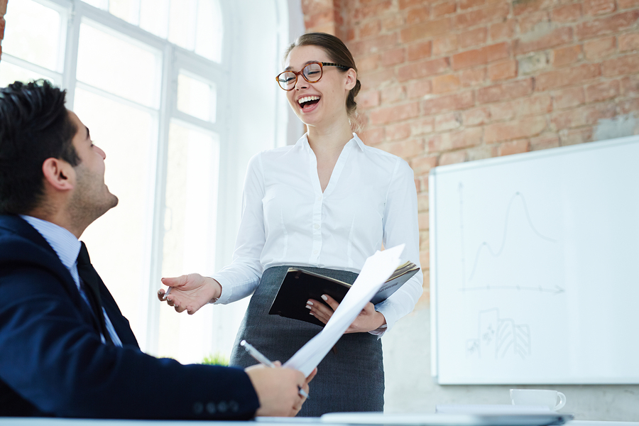 woman laughing with colleague