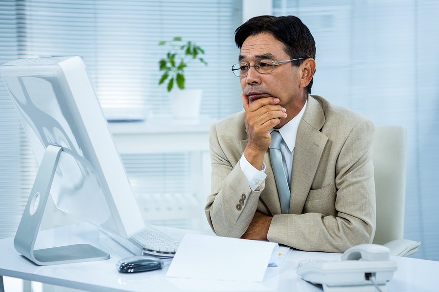 man looking at computer