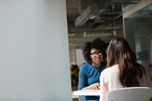 two people in a closed discussion