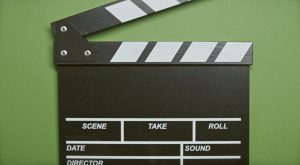 movie clapper on a green background